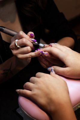 Smoothing out and filing the acrylic nails