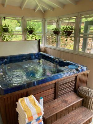 Hot tub on back porch.