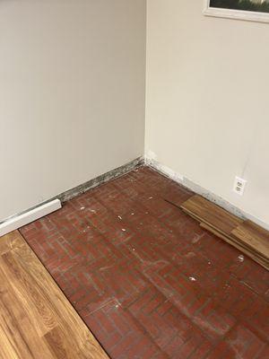 Water damage baseboard and floor repair