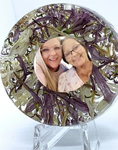 Custom memorial with loved ones funeral flowers sealed in resin with client's photo of choice.