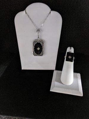 White Gold Estate Jewelry.
 Onix stone on a Pendant filigree mounting, and squeare shape onix ring, both has a accent diamond on the center.