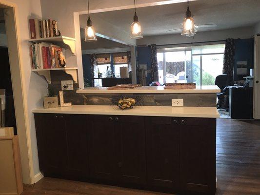 Wall opened and cabinets and countertop added.