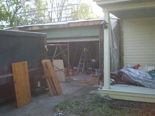 Old attached flat roof garage ready to fall down