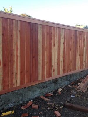 Redwood picket fence