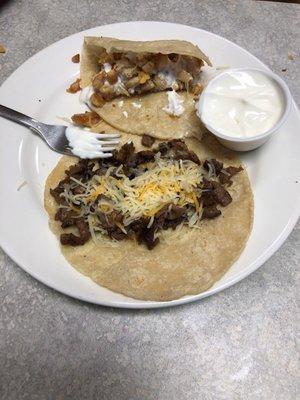 My son ordered steak taco w flour and cheese.  Lots of meat.  Good bargain !