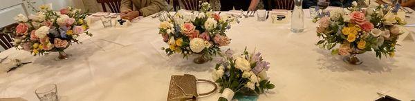 Our table arrangements and the bride's bouquet.