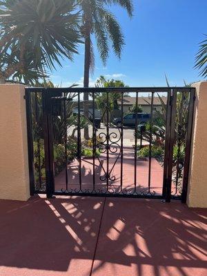 Front gate removed, repainted to match new handrails, and expertly reinstalled.