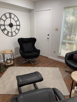 Therapy office with warm, inviting nature views.