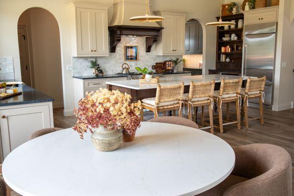 Quartz dining table and beautiful quartz and soapstone kitchen.