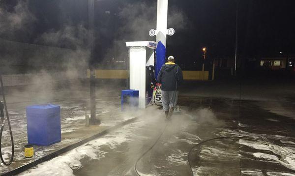 Power washing and surface cleaning a gas station