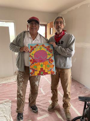 Vaughn Harris and Tracy with a gift to Tracy as they prepped walls at Casa Veranda Gallery.