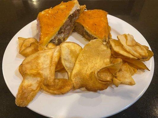 Inside out Brisket grilled cheese. Served with chips or skin on steak fries