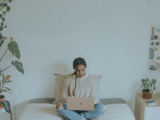 A woman on the computer launching her dream business!