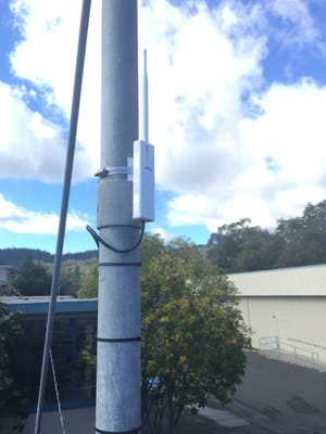 Installed long distance network antenna for connecting multiple buildings with high speed internet