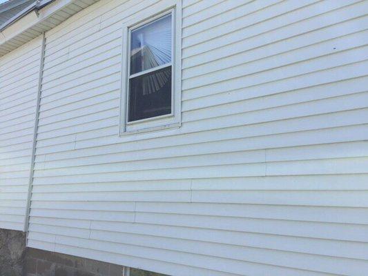 This house looks new again. It looks WHITE. Pressure wash your house to add value and curb appeal.