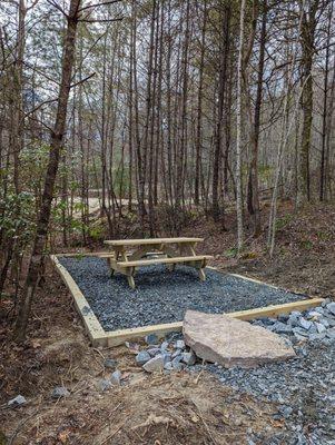 Picnic table and fire ring w/ swivel cooking grate for your outdoor enjoyment.