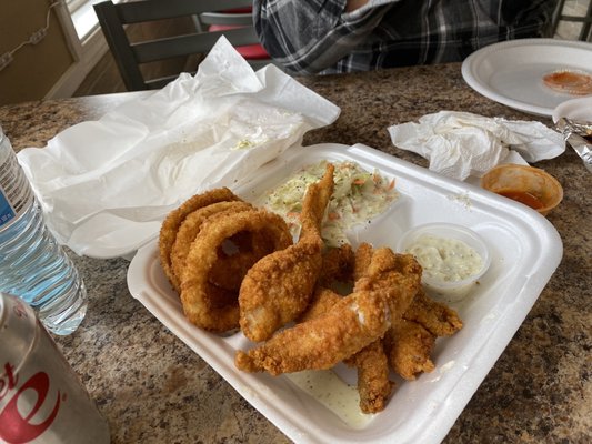 That catfish combo is crispy and delightful- crunchy onion rings and sweet slaw!