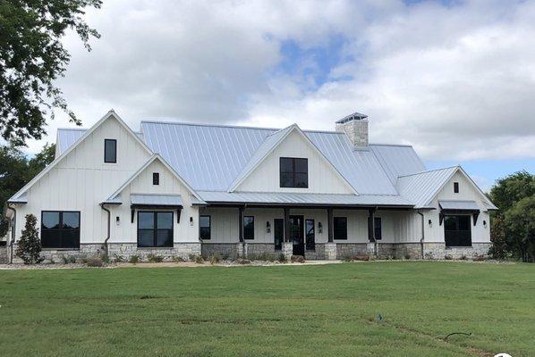 Installation of standing seam roofing system, along with custom stone work and 1/2 round gutters.