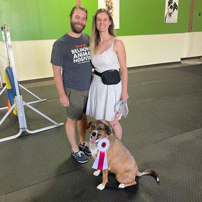 Trainer Alexa with Chris and Penny enjoying a fun day of agility - one of our favorite enrichment activities!