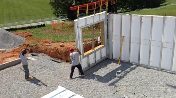 Team K-Wall installing a MonoKast insulated precast concrete basement.