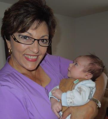 Me and a 6 week old grad. Now a totally calm and laid-back baby. I love my new moms and their babies. So joyful!