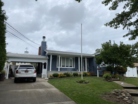 Siding and soffits. Certainteed Pacific Blue Siding, beadboard soffit and VersaWrap porch posts.