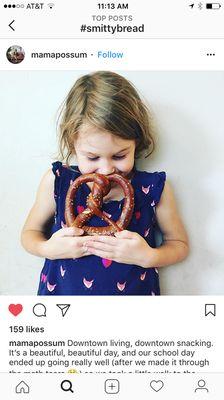 A young Smittybread fan and her pretzel.