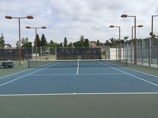 Tennis courts open to the public. Well-lit, clean lines, and nets that don't sag. Plenty of parking, too.