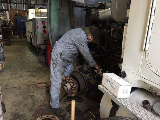 Tim installing king pins on a customers truck