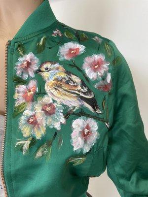 Green sport jacket with hand-painted bird and flowers. The paints are permanent and high quality l.