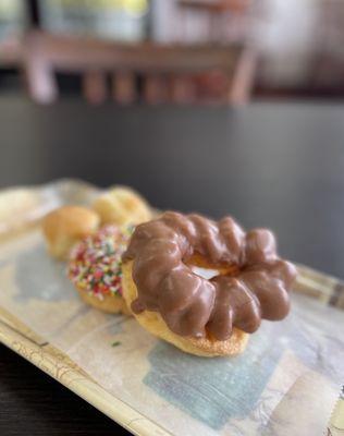 Chocolate French Cruller, Chocolate with Rainbow Sprinkles Cake, and donut holes