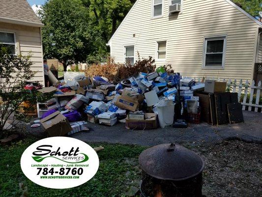 Big trailer load of trash & debris removal in driveway-before
 Junk Removal Indianapolis