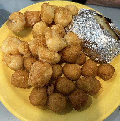 Scollops, hush puppies and baked potato.