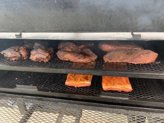 Smoker loaded with brisket, pork and pork belly