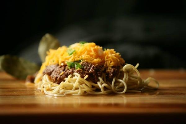 The Way - Pasta topped with Hills chili and smothered with fresh hand-shredded cheddar cheese optional onions or beans