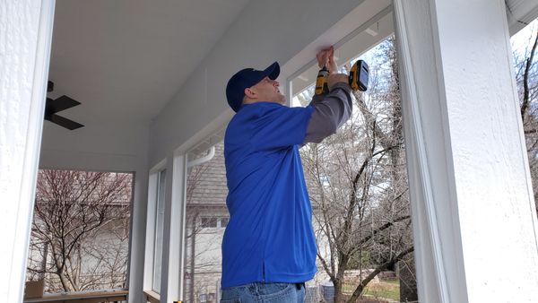 One of our highly qualified and trained  Screen Surgeons installing a new aluminum screen frame system for large openings