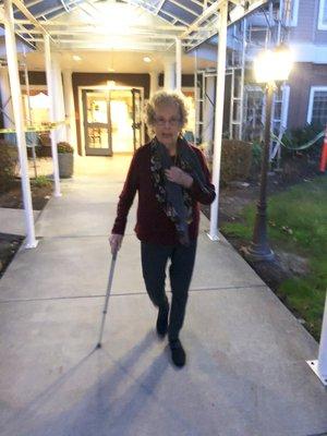 She went from a walker to a cane due to better leg strength