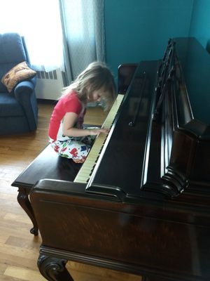 Minutes after my grandmother's piano was delivered, my daughter hopped on.