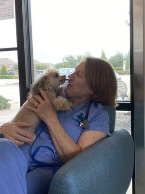 Dr. Douglass hanging out with Pongo after his dental cleaning.