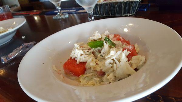 Cold crab salad over watermelon with infused mint oil. Prepared by chef Jacob Merritt...excellente'