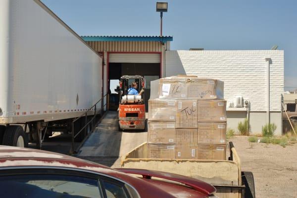 Loading pallets in my trailer for the last five miles of their journey.