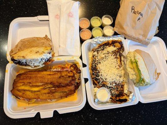 Arepa Grill takeout. Arepa Pabellon ($7.99), Patacon Maduro Carne ($9.99), Cachapa Queso Mano ($8.99), Arepa Reina Pepiada ($6.99).