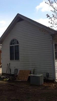 Side of home prior to new siding