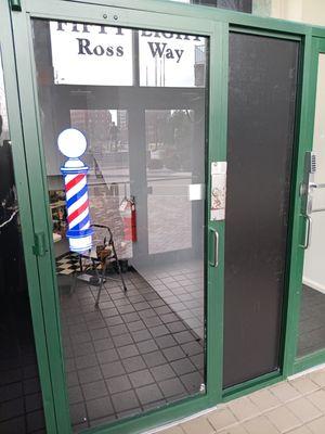 Painted front entrance of Mass School of Barbering