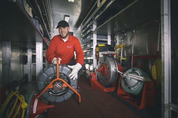 Technician preparing to do a video inspection by gathering equipment from our fully equipped service truck. Inspection, Video, Drains, Sewer