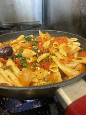 Penne pasta and puttanesca sauce