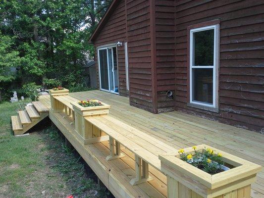 Deck after with built in planters and benches.