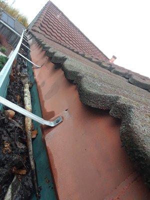 Gutter cleaning in the rain season