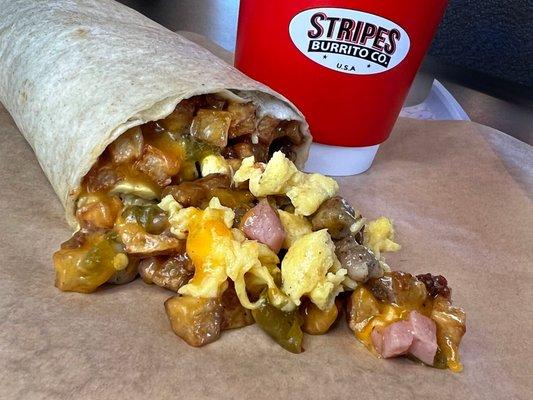 Meat lovers breakfast burrito with green chile