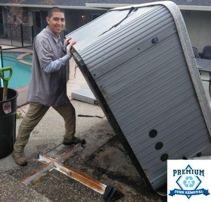 Flipping up an old hot tub. Getting ready for removal